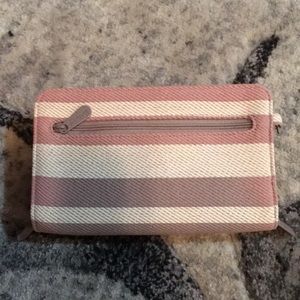 Striped pink, brown and white wallet.